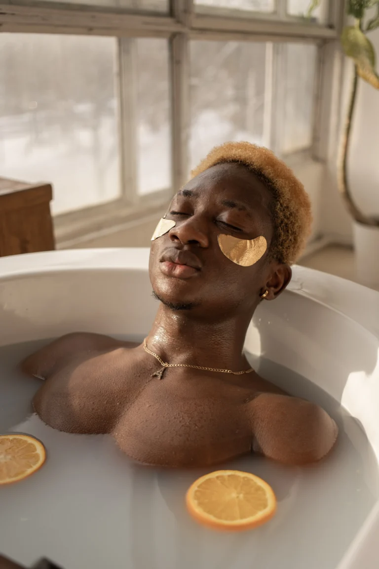 black man laying in the bathtub with orange slices