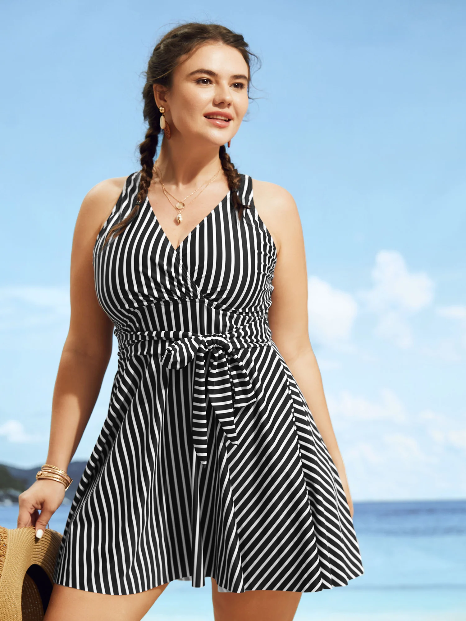 BloomChic striped swim dress with an overlap collar and tie-knot detail