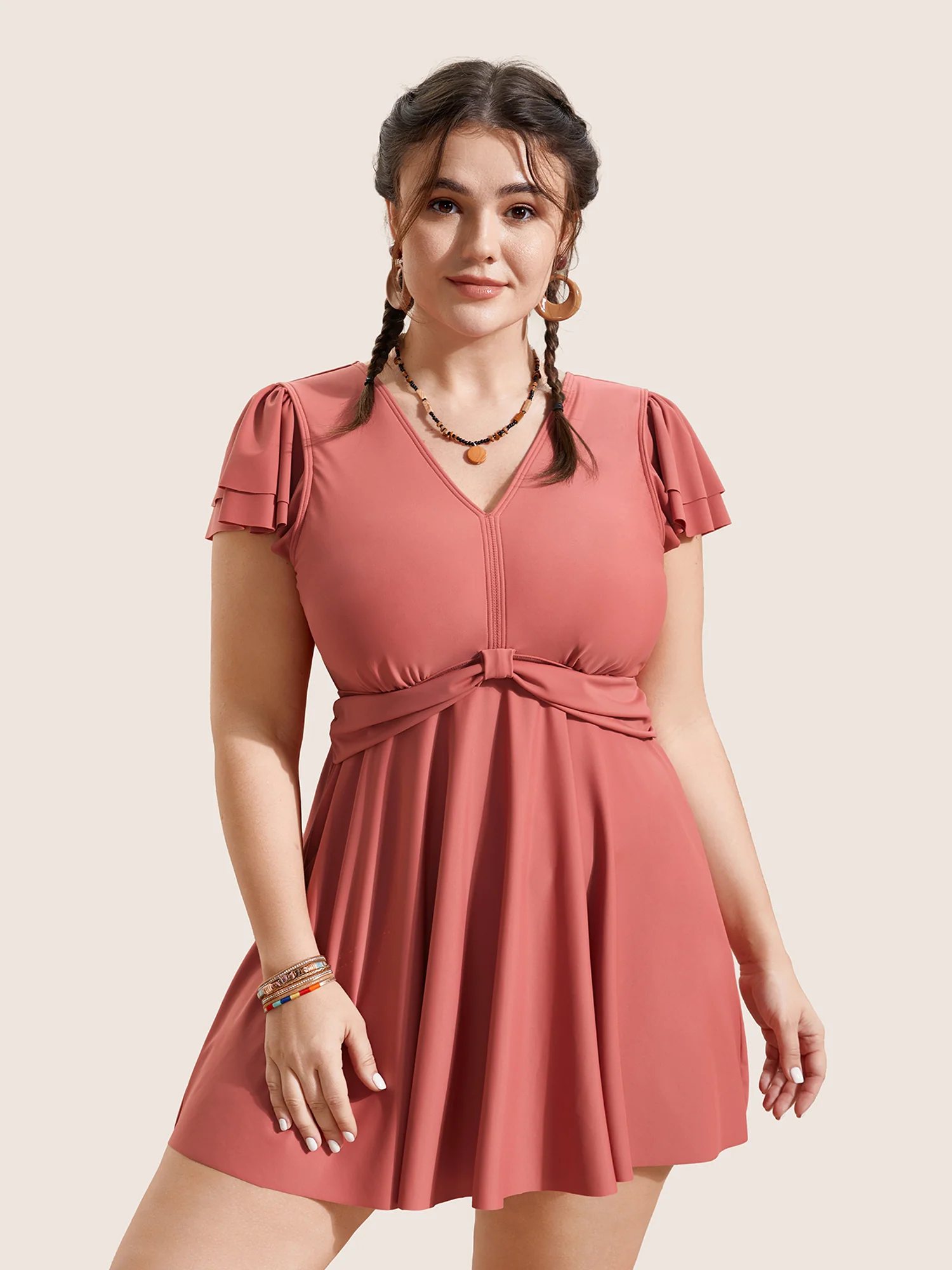 BloomChic solid swim dress with gathered tiers and ruffled sleeves