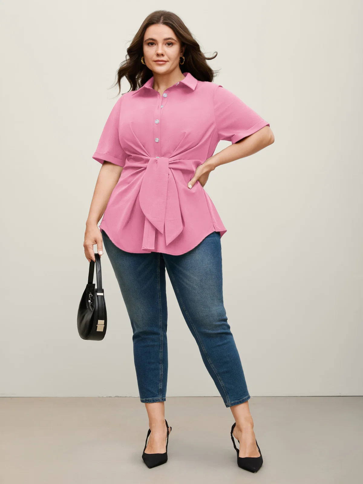 BloomChic blouse with a knotted front and asymmetrical hem