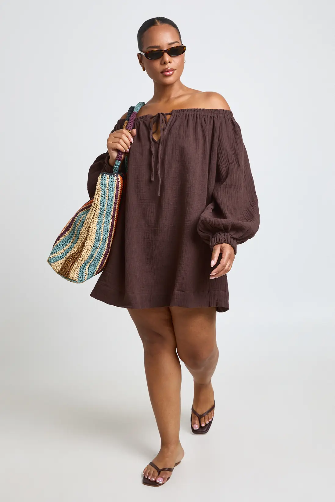 Model wearing the chocolate Boohoo plus-size Bardot volume-sleeve beach dress