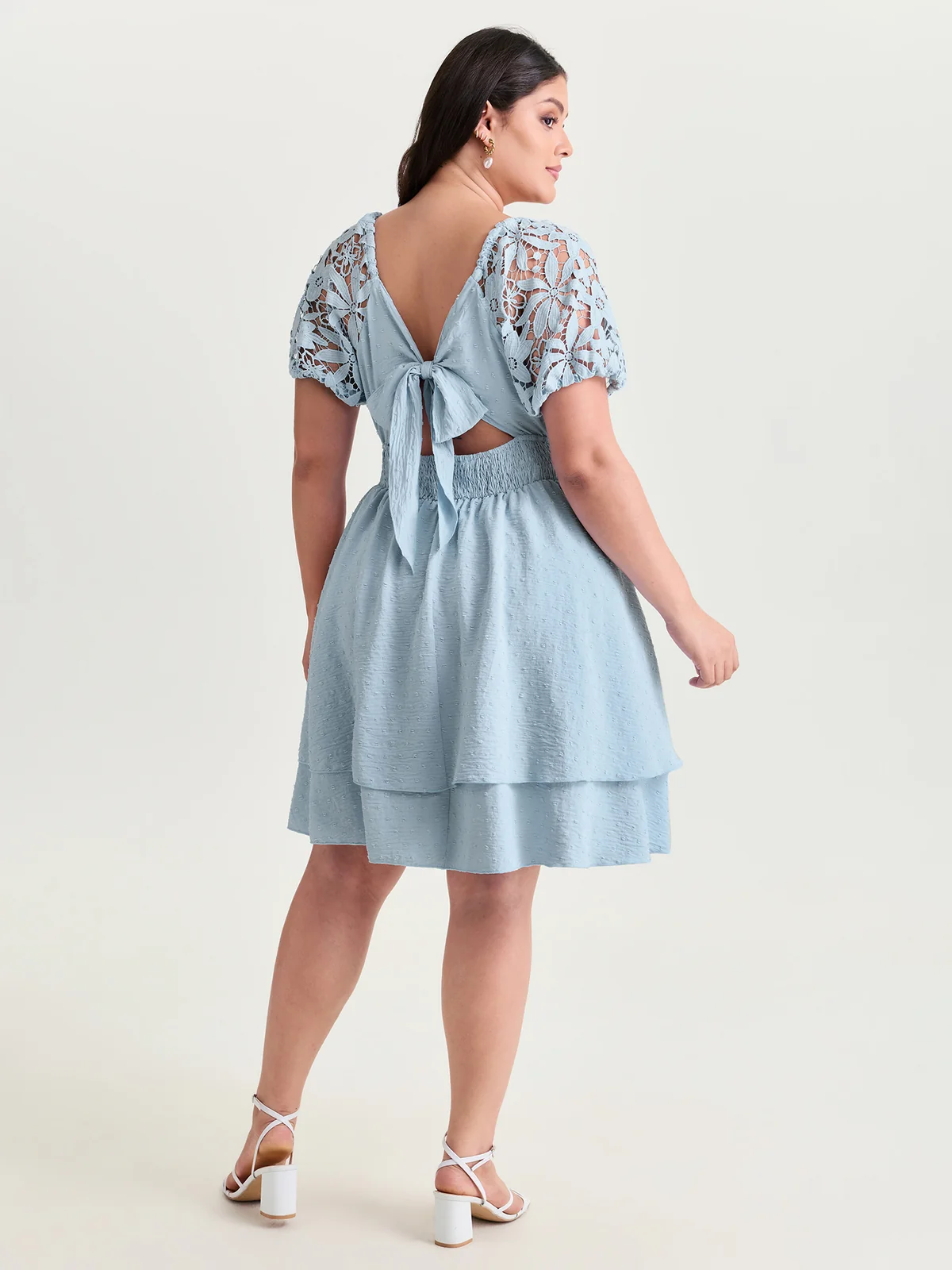 BloomChic light blue mini dress with sheer lace sleeves and an open back