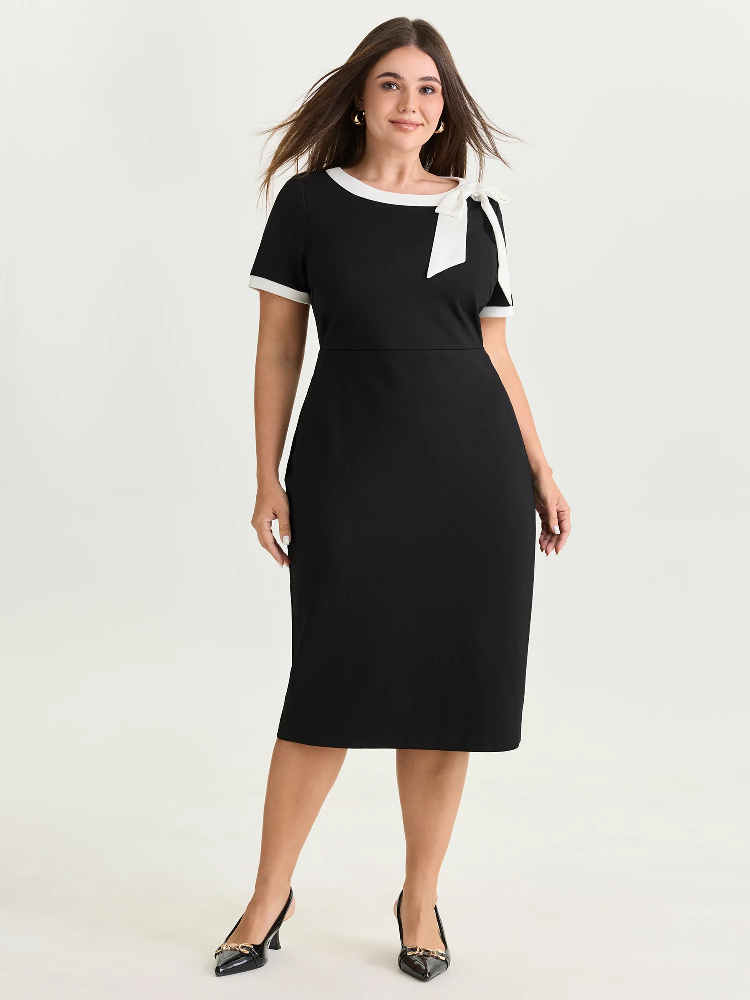 BloomChic black and white color-contrast midi dress with a side bow