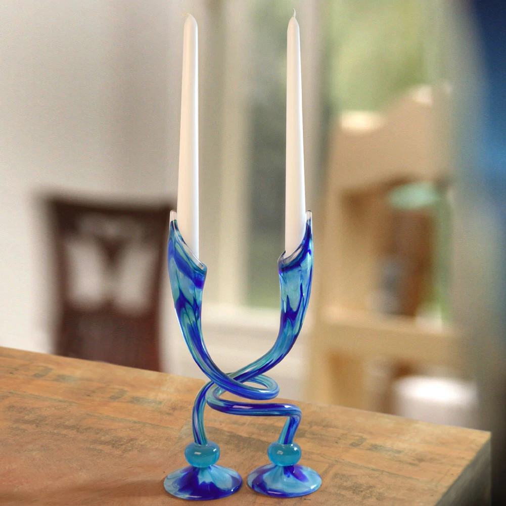 Pair of hand-blown glass embracing candlesticks.