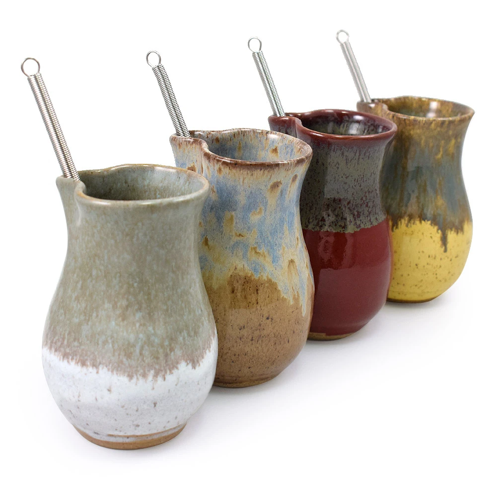 Mini ceramic mixing pitcher with whisk shown in four glaze options.