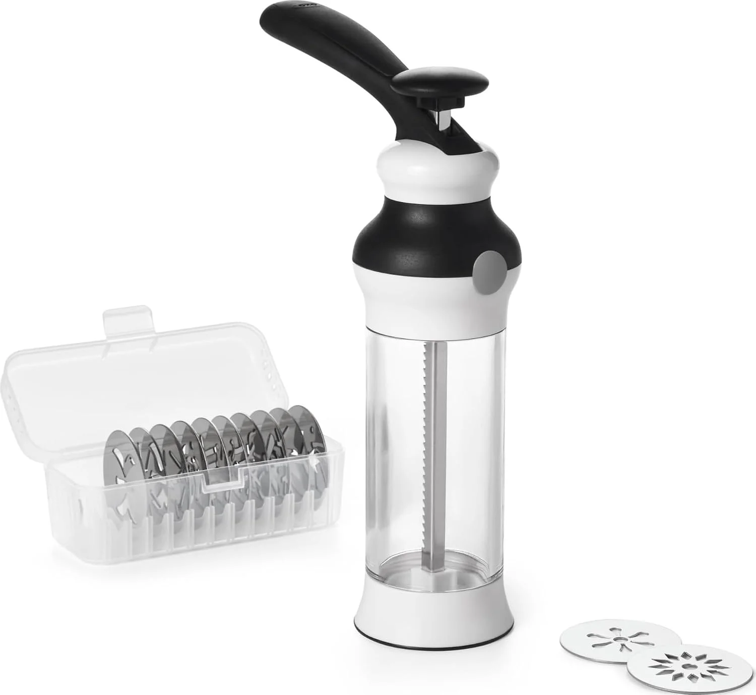 OXO cookie press beside its storage case and patterned metal discs.