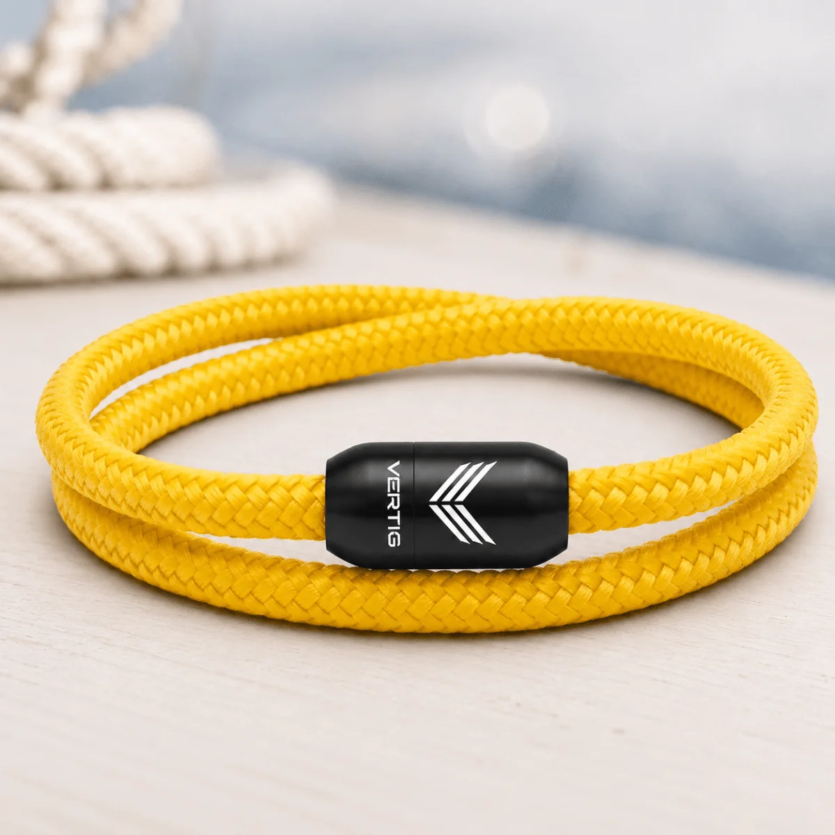 77 Best Christmas Gift Ideas That Feel Personal, Useful and Fun 60 Yellow braided paracord bracelet with a black Vertig magnetic clasp.