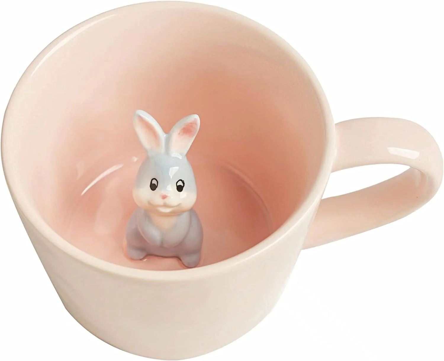 Pale pink ceramic mug with a small grey bunny figure inside