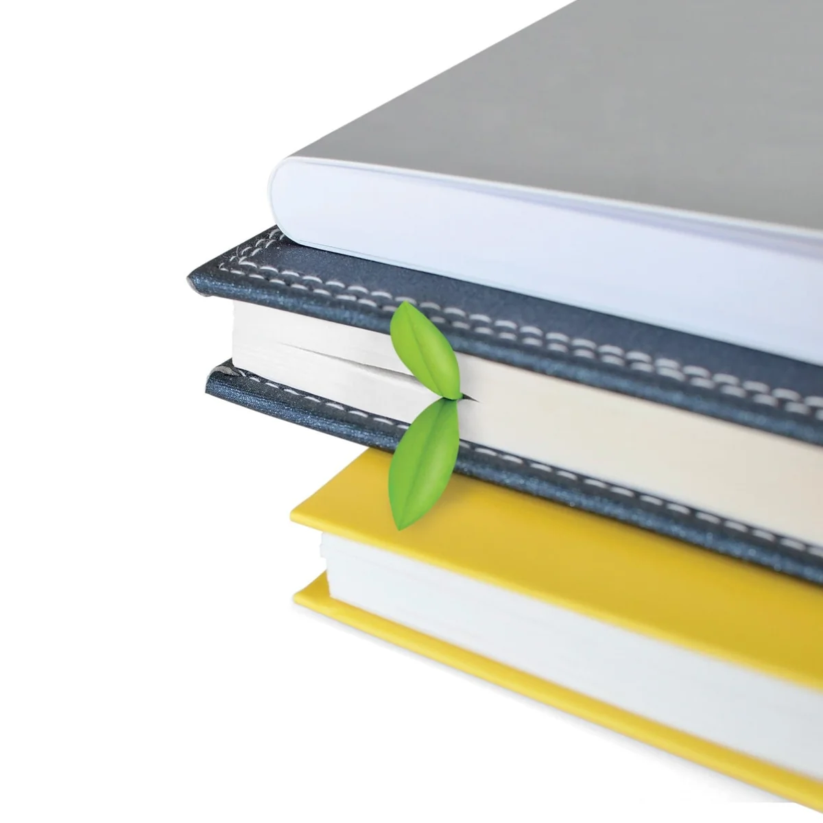 Green FRED Sprout bookmark tucked between the pages of a book in a stack.