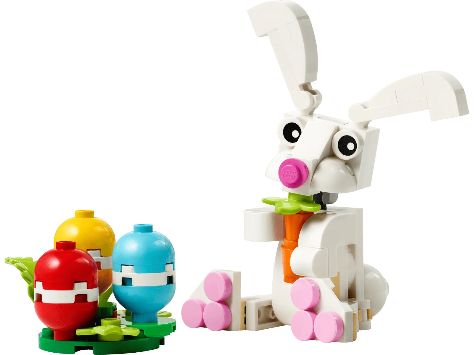 LEGO Easter bunny holding a carrot beside three colorful brick-built eggs.
