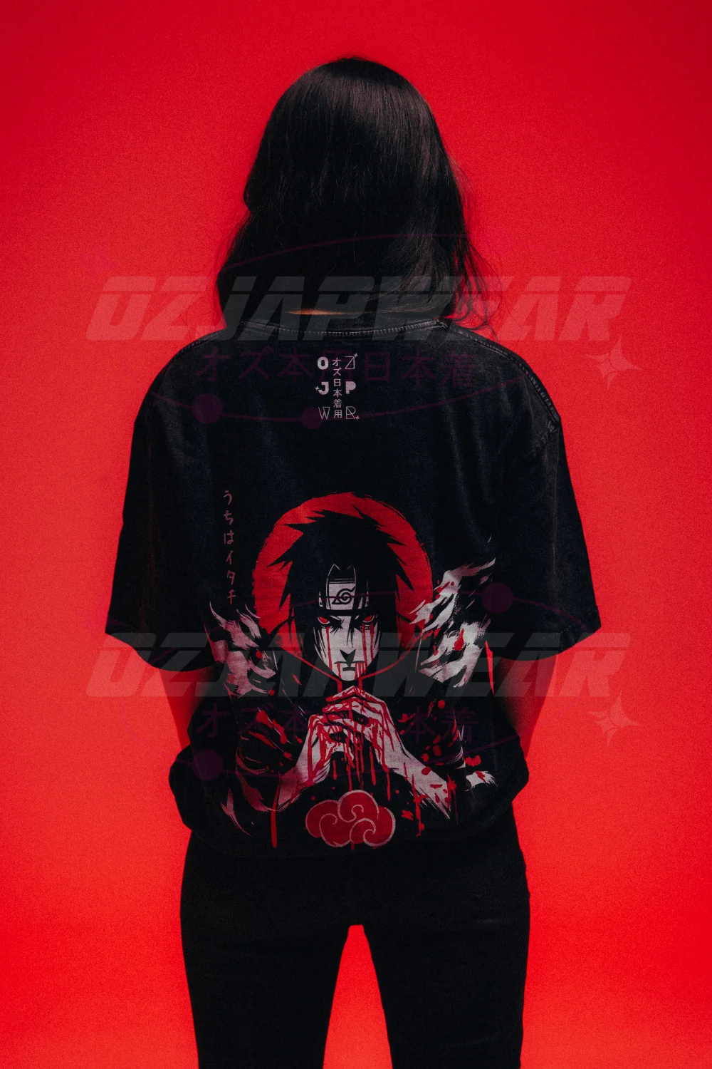 77 Best Christmas Gift Ideas That Feel Personal, Useful and Fun 71 Back of a black oversized Itachi Uchiha T-shirt with a red and white character design.