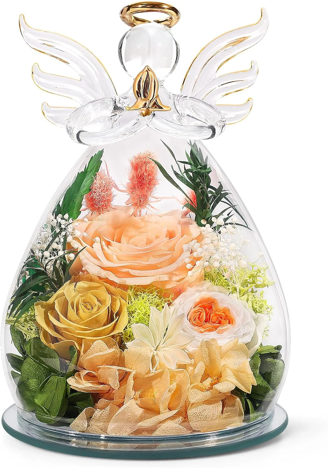 Glass angel figurine containing cream and peach flowers with green foliage.