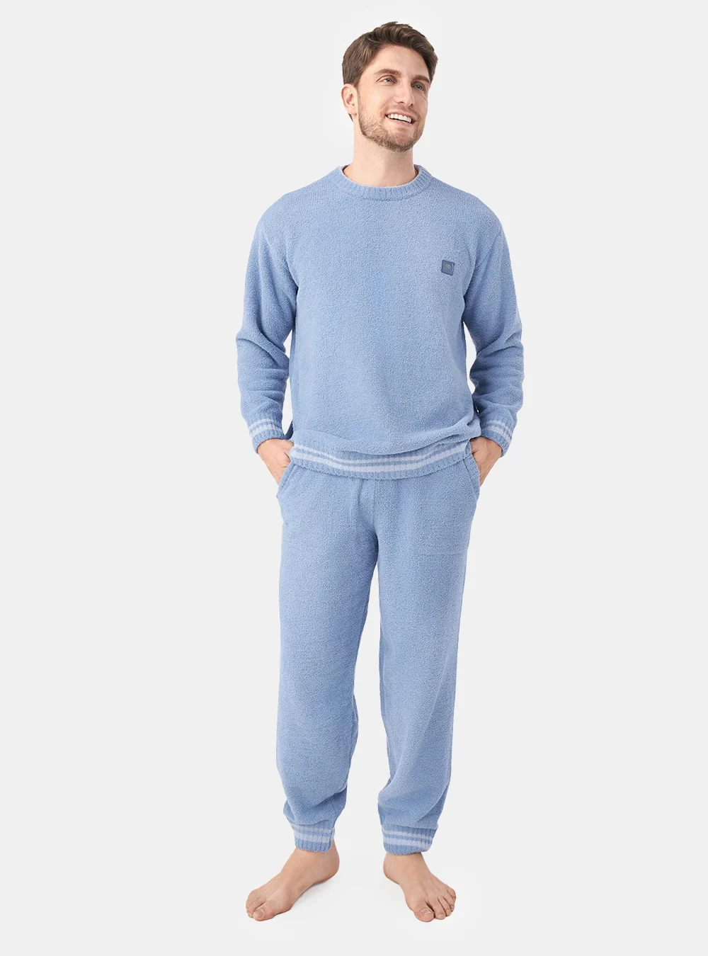 David Archy Presents For Him: Everyday Basics and Cozy Evenings 11 Model wearing a light blue crew neck fleece pajama set