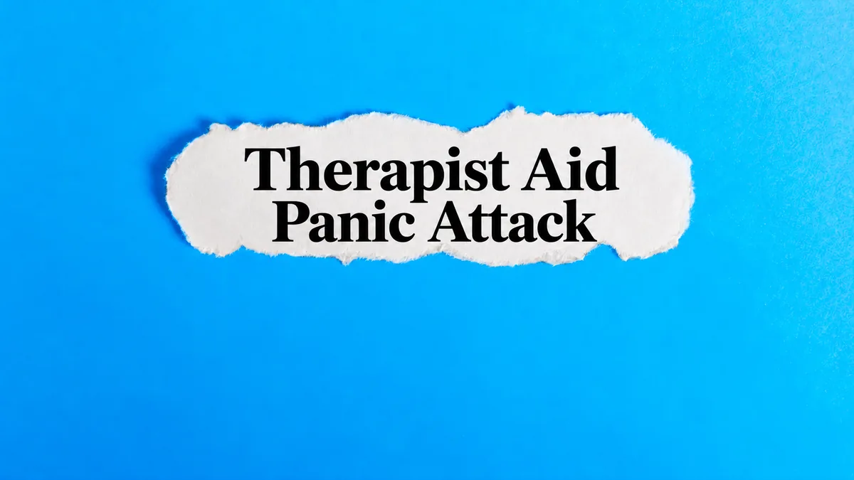 Torn white paper on a bright blue background with the words Therapist Aid Panic Attack.